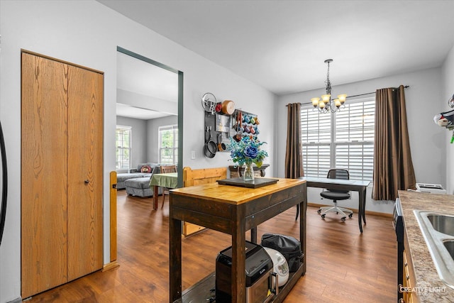 3621 Hyde Park Ct, Elgin, IL 60124 - dining space with a chandelier, wood finished floors, and a desk