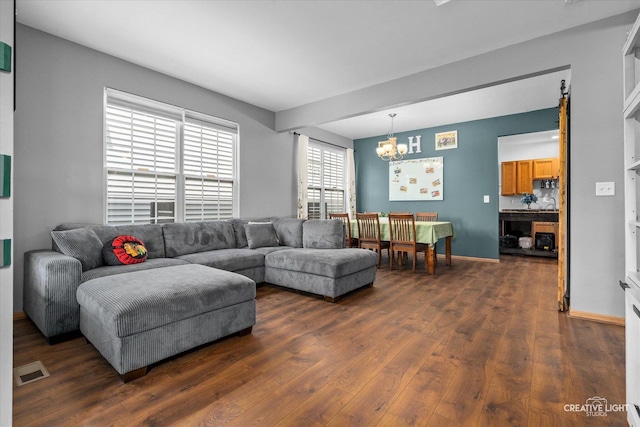 3621 Hyde Park Ct, Elgin, IL 60124 - living room with a chandelier and dark wood-style flooring