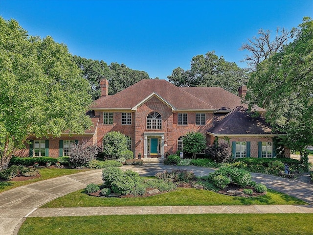 8 Buckingham Dr, Sugar Grove, IL 60554 - colonial home featuring a chimney and brick siding