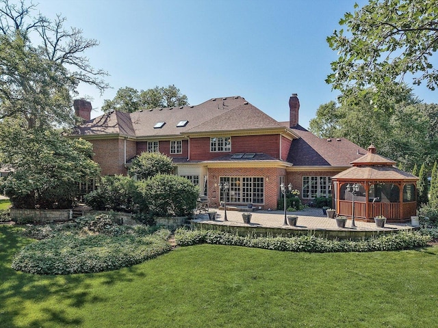8 Buckingham Dr, Sugar Grove, IL 60554 - back of property with a gazebo, a chimney, a patio area, a lawn, and brick siding
