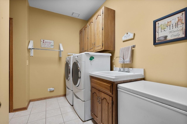 8 Buckingham Dr, Sugar Grove, IL 60554 - laundry room featuring washing machine and dryer, cabinet space, and light tile patterned floors