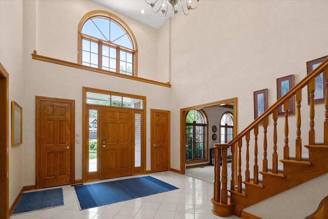 8 Buckingham Dr, Sugar Grove, IL 60554 - tiled foyer entrance with a towering ceiling, a chandelier, and stairway