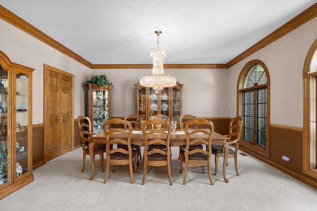 8 Buckingham Dr, Sugar Grove, IL 60554 - dining room featuring light carpet, wainscoting, crown molding, and a chandelier