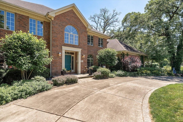 8 Buckingham Dr, Sugar Grove, IL 60554 - colonial-style house with brick siding and roof with shingles