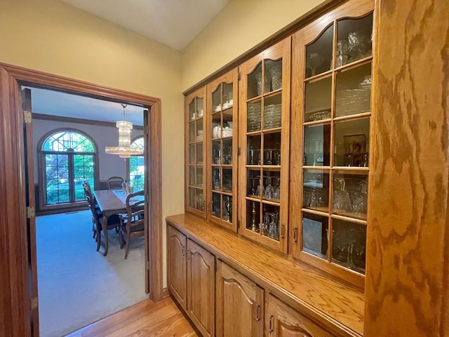 8 Buckingham Dr, Sugar Grove, IL 60554 - hall featuring a chandelier and light wood-style floors