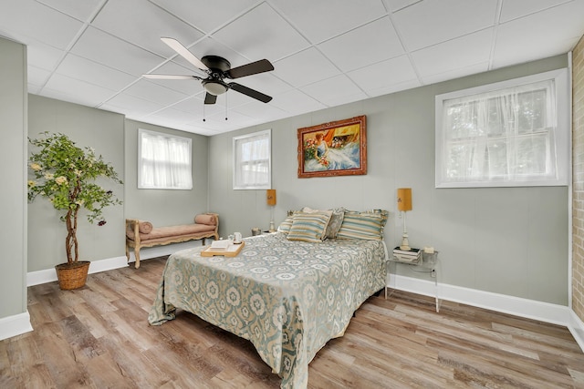 607 E Bridge St, Streator, IL 61364 - bedroom featuring wood finished floors, ceiling fan, and a drop ceiling