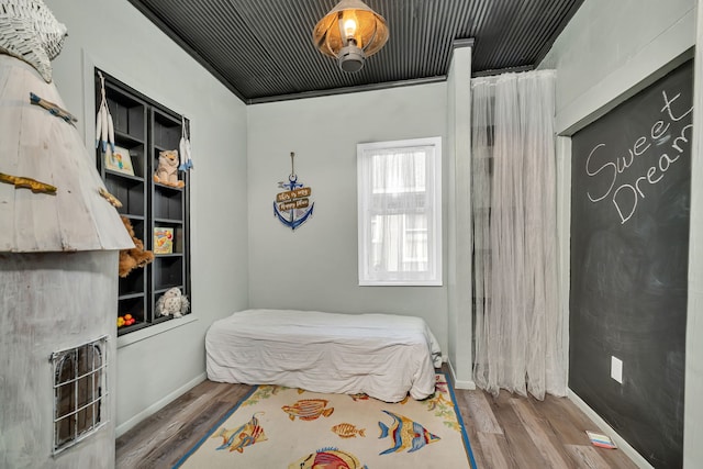 607 E Bridge St, Streator, IL 61364 - bedroom featuring wood finished floors and baseboards