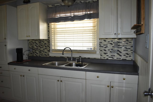 7710 W 81st Pl, Bridgeview, IL 60455 - kitchen featuring dark countertops, white cabinetry, and tasteful backsplash