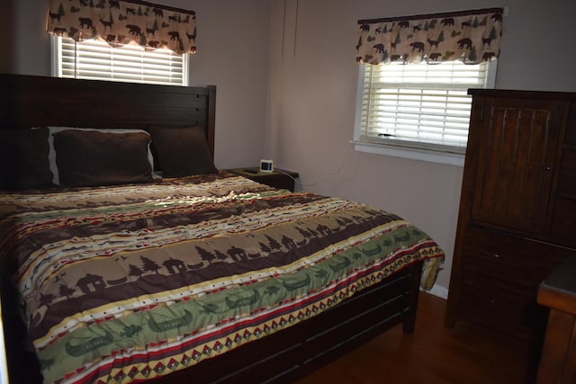 7710 W 81st Pl, Bridgeview, IL 60455 - bedroom featuring multiple windows and wood finished floors