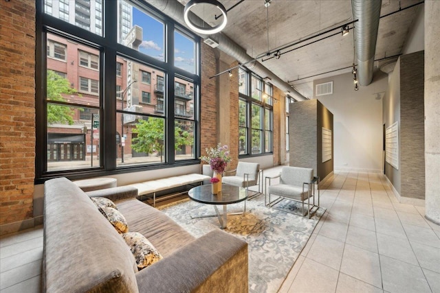 411 W Ontario St Unit 411, Chicago, IL 60654 - building lobby featuring a high ceiling and brick wall