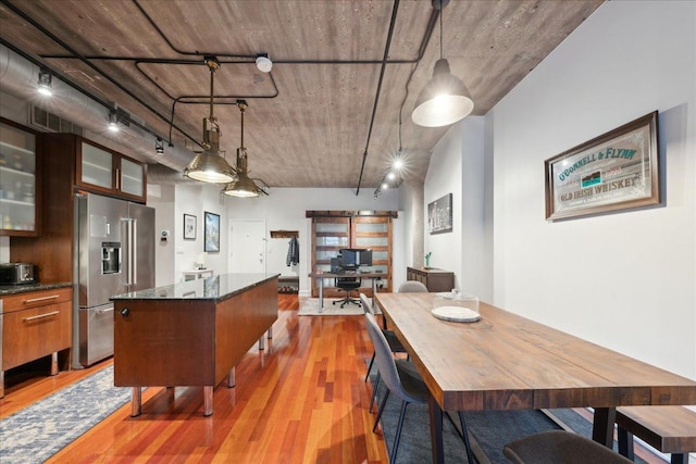 411 W Ontario St Unit 411, Chicago, IL 60654 - dining area with light wood finished floors and track lighting