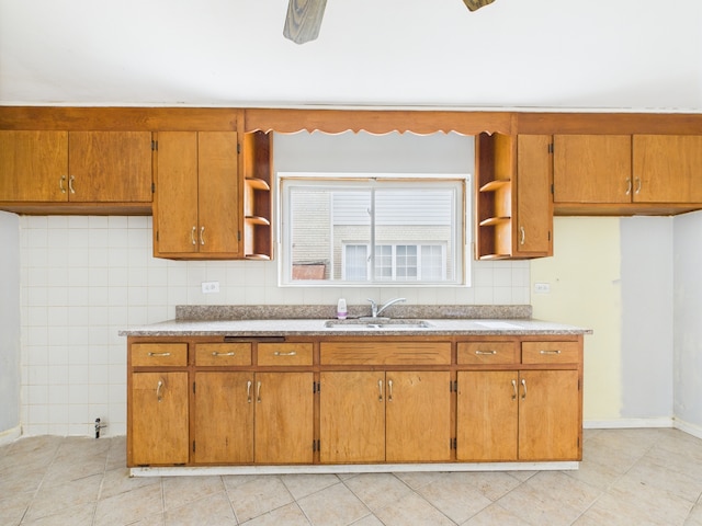 3810 W 71st St, Chicago, IL 60629 - kitchen featuring open shelves, brown cabinets, and light tile patterned flooring