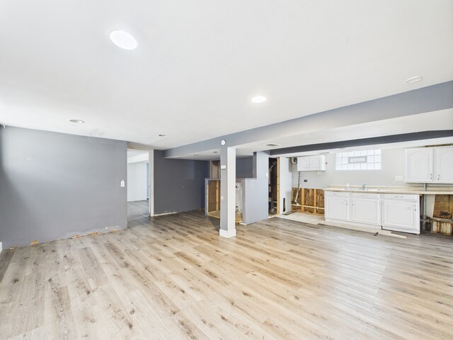 3810 W 71st St, Chicago, IL 60629 - unfurnished living room featuring light wood finished floors and recessed lighting
