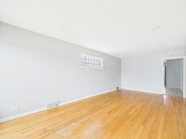 3810 W 71st St, Chicago, IL 60629 - empty room featuring light wood-type flooring and baseboards