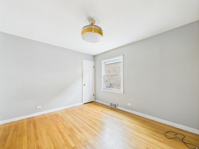 3810 W 71st St, Chicago, IL 60629 - unfurnished room featuring baseboards and wood finished floors