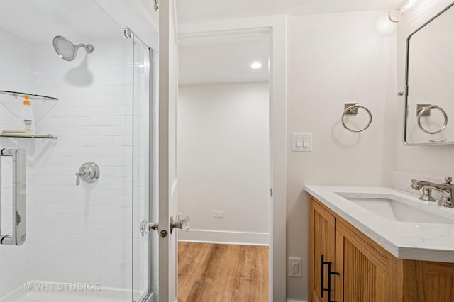 720 Willow Rd, Winnetka, IL 60093 - full bath with a stall shower, wood finished floors, and vanity