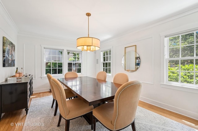 720 Willow Rd, Winnetka, IL 60093 - dining room with plenty of natural light, ornamental molding, a chandelier, and light wood-style flooring
