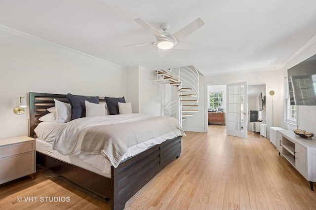 720 Willow Rd, Winnetka, IL 60093 - bedroom featuring light wood-style flooring, ornamental molding, ceiling fan, and french doors