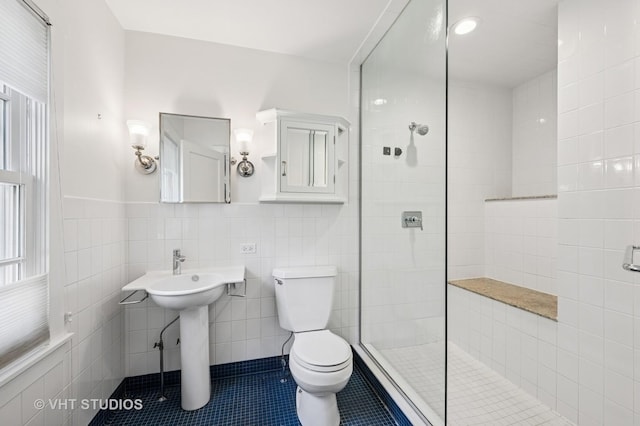 720 Willow Rd, Winnetka, IL 60093 - full bath with tile walls, walk in shower, tile patterned floors, and a wainscoted wall