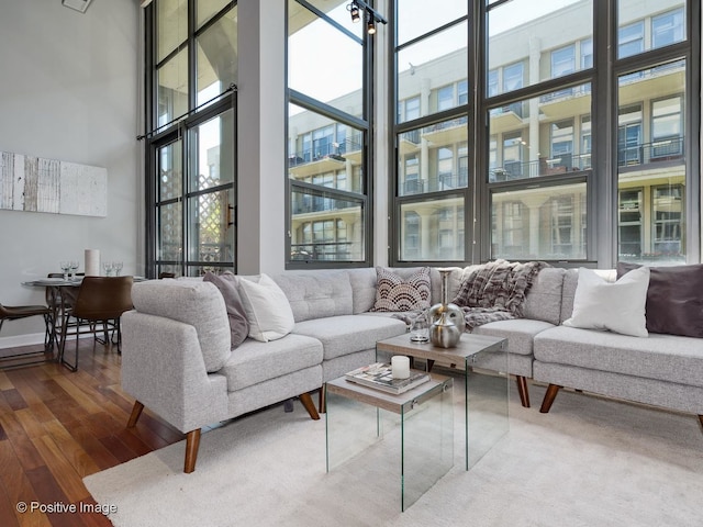 900 N Kingsbury St Unit 967, Chicago, IL 60610 - living area with plenty of natural light, a towering ceiling, and dark wood finished floors