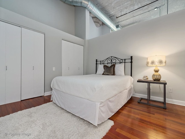 900 N Kingsbury St Unit 967, Chicago, IL 60610 - bedroom with multiple closets, hardwood / wood-style floors, and a high ceiling