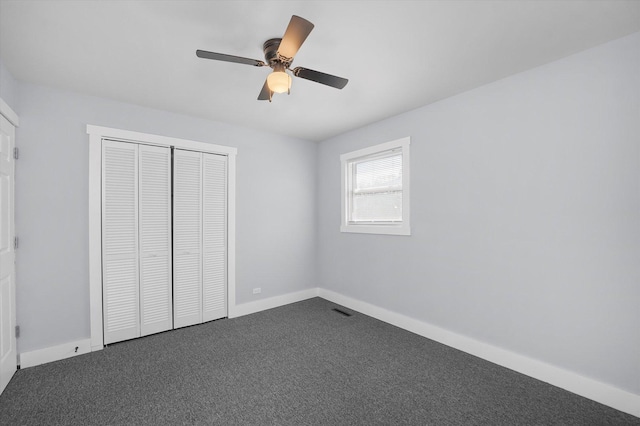 329 Blackhawk Dr, Park Forest, IL 60466 - unfurnished bedroom featuring dark colored carpet, a closet, and ceiling fan