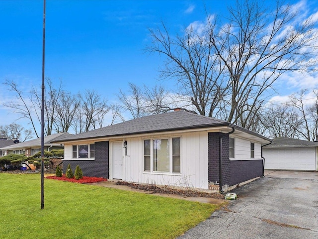 329 Blackhawk Dr, Park Forest, IL 60466 - single story home featuring brick siding, a garage, an outbuilding, a front lawn, and a chimney