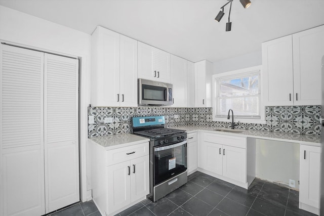 329 Blackhawk Dr, Park Forest, IL 60466 - kitchen featuring stainless steel appliances, light countertops, tasteful backsplash, and dark tile patterned flooring