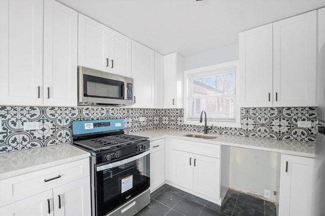329 Blackhawk Dr, Park Forest, IL 60466 - kitchen featuring stainless steel appliances, light countertops, tasteful backsplash, and white cabinets