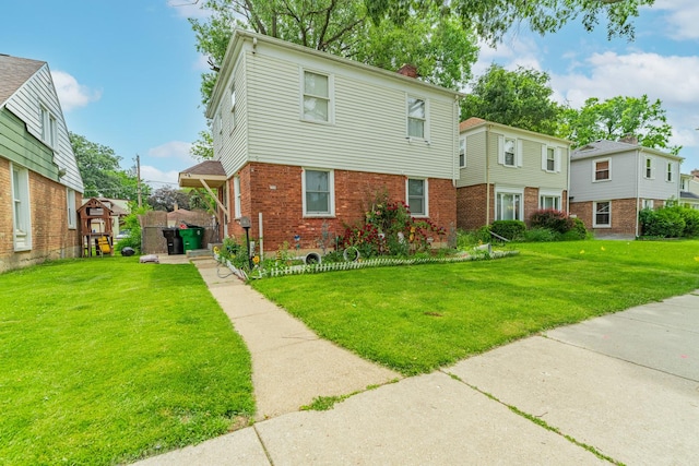 759 Norfolk Ave, Westchester, IL 60154 - colonial inspired home featuring brick siding, a front lawn, and a chimney