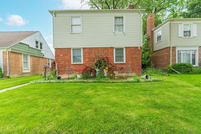 759 Norfolk Ave, Westchester, IL 60154 - rear view of house with a lawn, a chimney, and brick siding