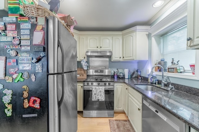759 Norfolk Ave, Westchester, IL 60154 - kitchen featuring stainless steel appliances, under cabinet range hood, dark stone countertops, and light wood-style floors