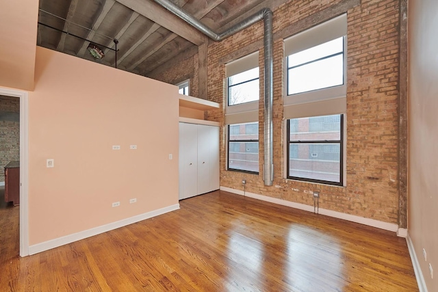 2545 S Dearborn St Unit 323, Chicago, IL 60616 - unfurnished room featuring high vaulted ceiling, wood finished floors, and a wood ceiling with exposed beams