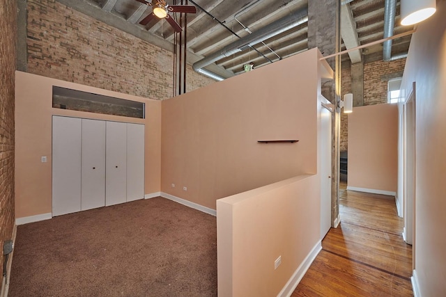 2545 S Dearborn St Unit 323, Chicago, IL 60616 - hallway with a towering ceiling and brick wall