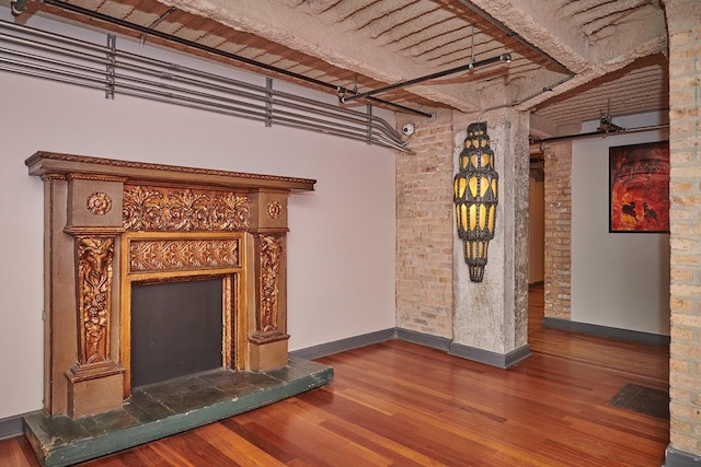 2545 S Dearborn St Unit 323, Chicago, IL 60616 - unfurnished living room with wood finished floors and baseboards