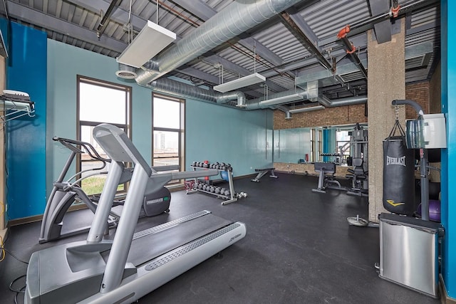2545 S Dearborn St Unit 323, Chicago, IL 60616 - workout area with healthy amount of natural light and brick wall
