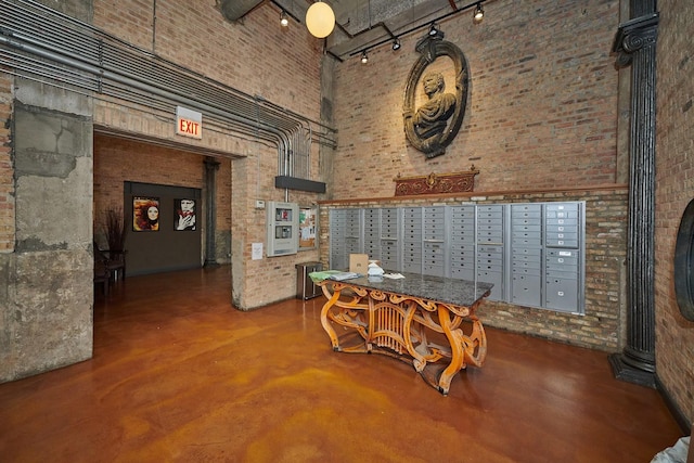 2545 S Dearborn St Unit 323, Chicago, IL 60616 - surrounding community featuring mail area, brick wall, and a high ceiling