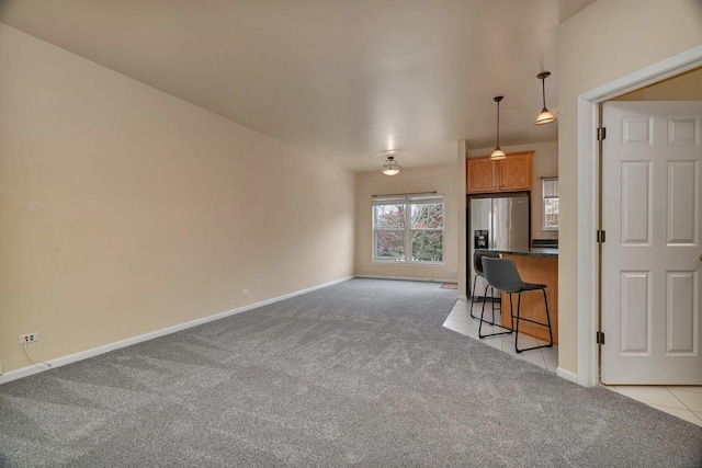 1109 Longwood Dr, Lisle, IL 60532 - unfurnished living room featuring light carpet and baseboards