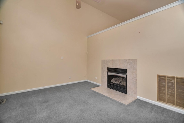 1109 Longwood Dr, Lisle, IL 60532 - unfurnished living room with dark colored carpet, a tiled fireplace, and ceiling fan