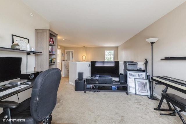 carpeted office space featuring baseboards