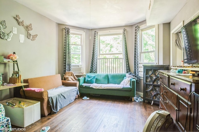 2939 N Springfield Ave, Chicago, IL 60618 - living room featuring healthy amount of natural light, dark wood finished floors, and cooling unit