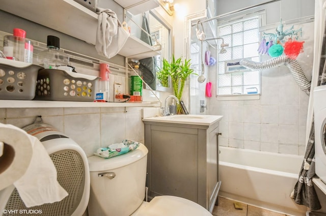 2939 N Springfield Ave, Chicago, IL 60618 - bathroom with vanity, plenty of natural light,  shower combination, tile patterned floors, and tile walls