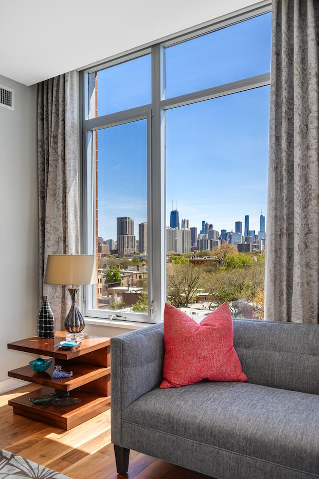 540 W Webster Ave Unit 611, Chicago, IL 60614 - sitting room with a view of skyline, wood finished floors, and a wall of windows