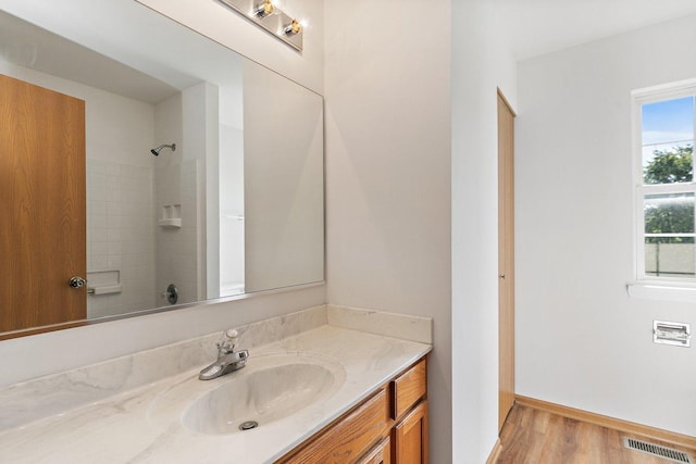 2315 Woodside Dr, Carpentersville, IL 60110 - bathroom featuring vanity, wood finished floors, and a shower