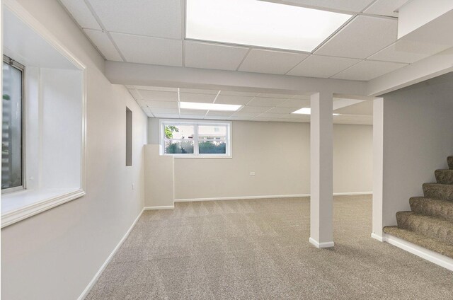 2315 Woodside Dr, Carpentersville, IL 60110 - basement with a drop ceiling, carpet, and stairs