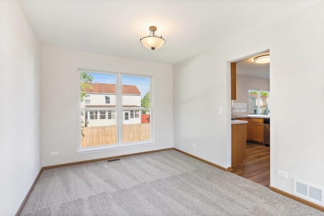 2315 Woodside Dr, Carpentersville, IL 60110 - empty room with dark carpet and baseboards