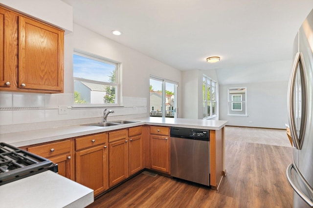 2315 Woodside Dr, Carpentersville, IL 60110 - kitchen with appliances with stainless steel finishes, a peninsula, dark wood-style floors, light countertops, and recessed lighting