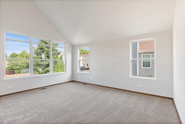 2315 Woodside Dr, Carpentersville, IL 60110 - carpeted empty room featuring lofted ceiling and baseboards