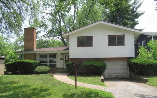 3636 Elm Ct, Flossmoor, IL 60422 - split level home with a chimney, a garage, driveway, and a front yard