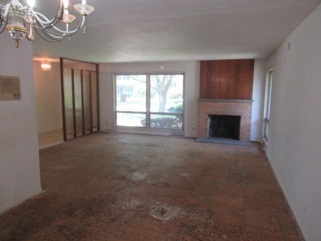 3636 Elm Ct, Flossmoor, IL 60422 - unfurnished living room with a chandelier and a brick fireplace